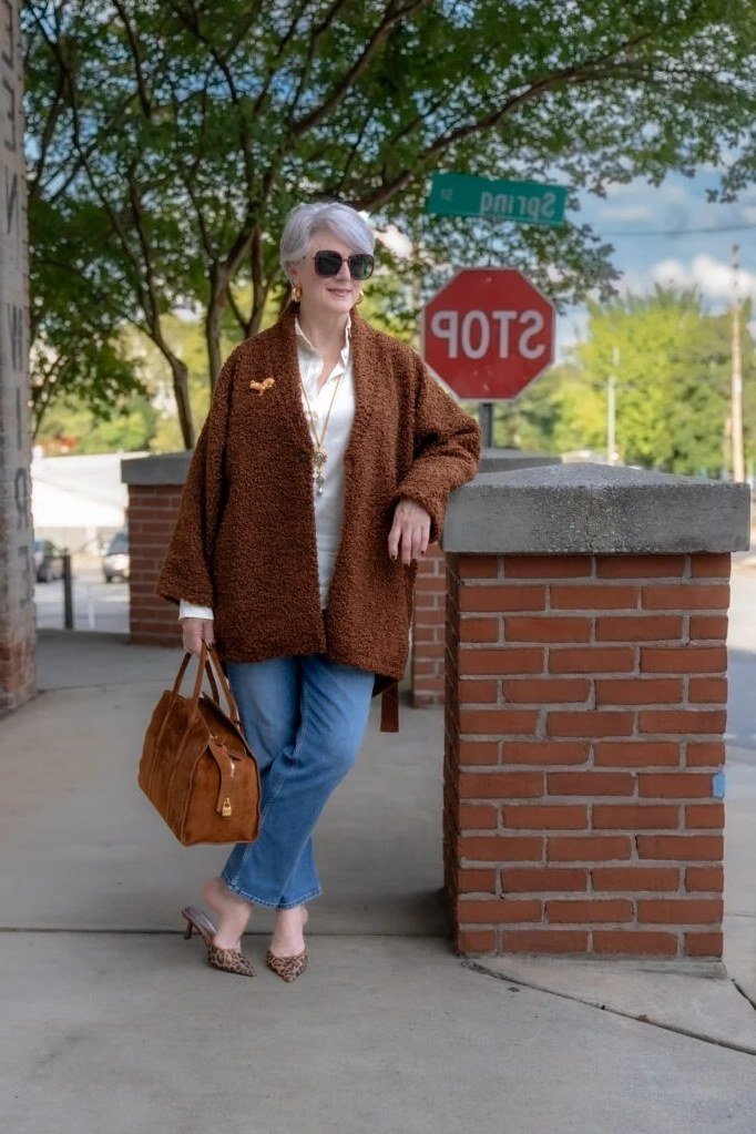 brown suede jacket white top jeans fall outfit over 50