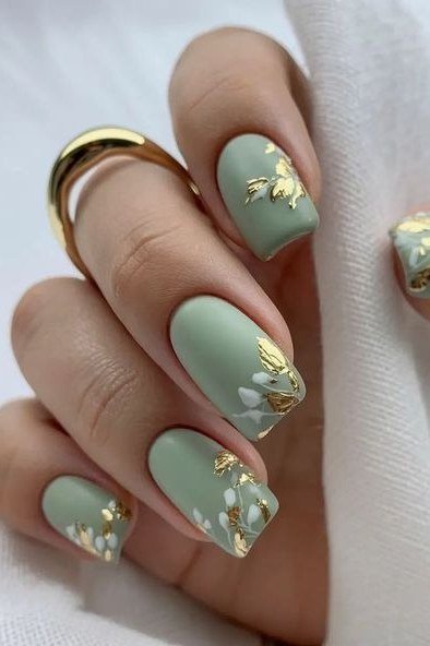 Sage green nails with gold foil accents, best manicure idea for women over 60