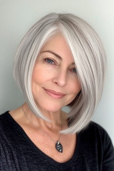 Silver bob with rounded shape - trendy short haircut for older women with fine hair