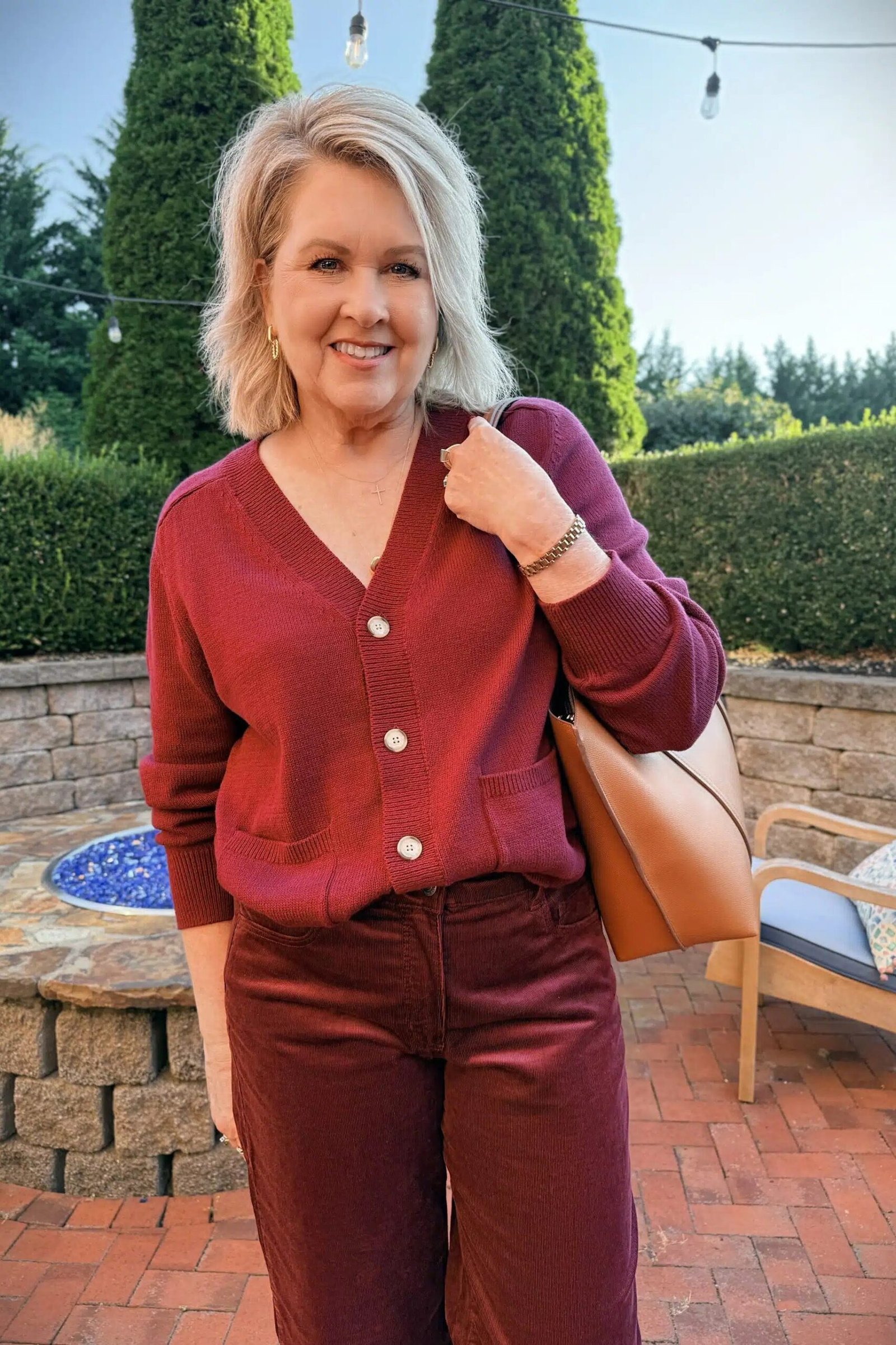 burgundy button cardigan burgundy top trousers tan shoulder bag women over 50