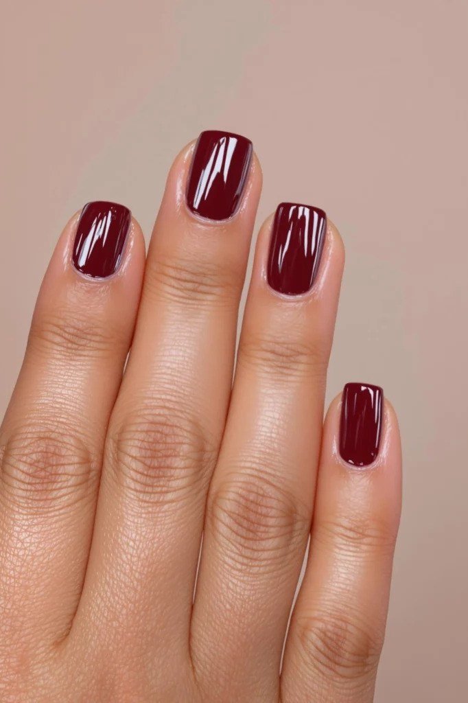 Dark cherry solid polish, glossy - classy nail design for older women