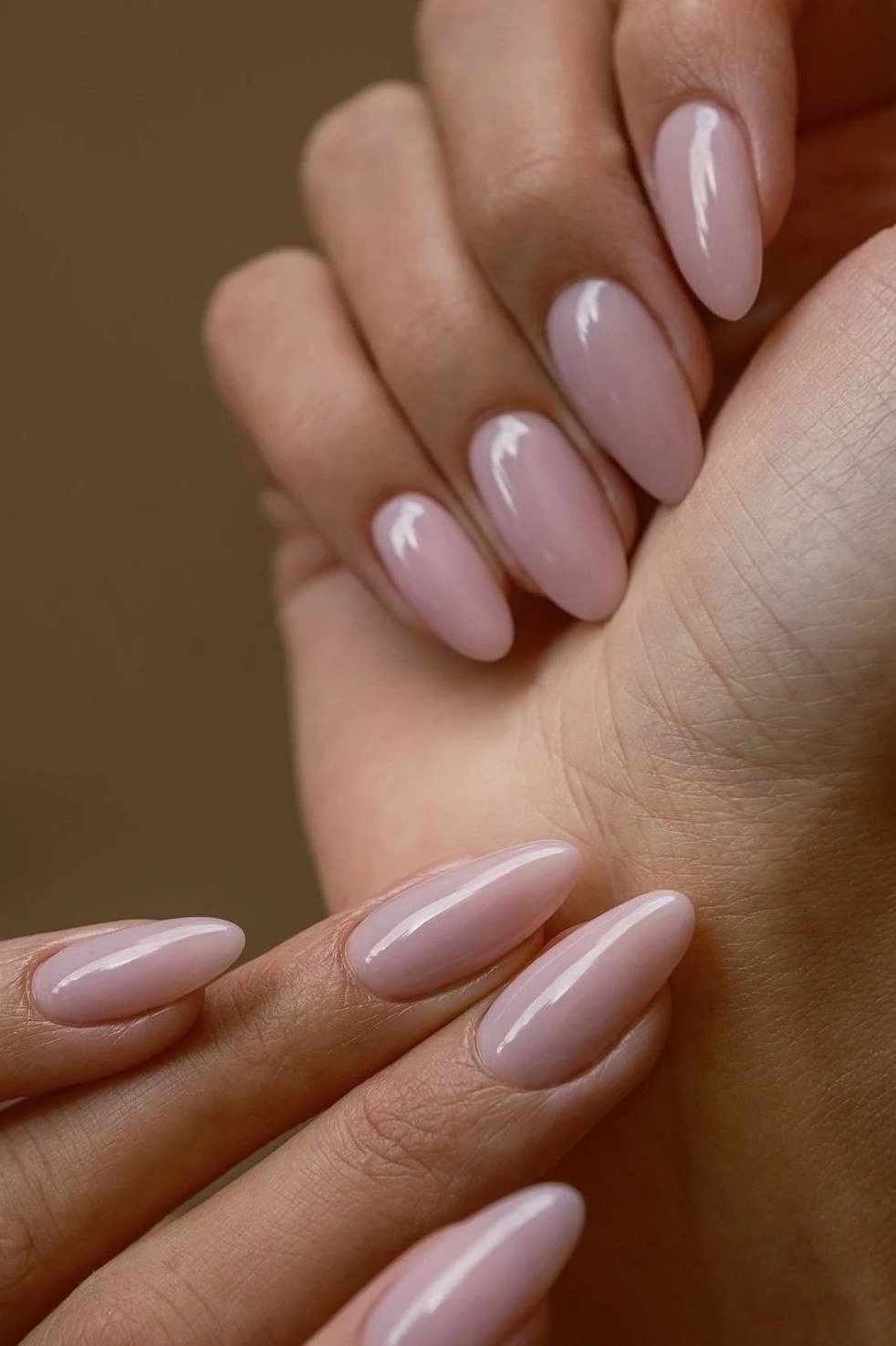 Lilac nude almond nails with two hands