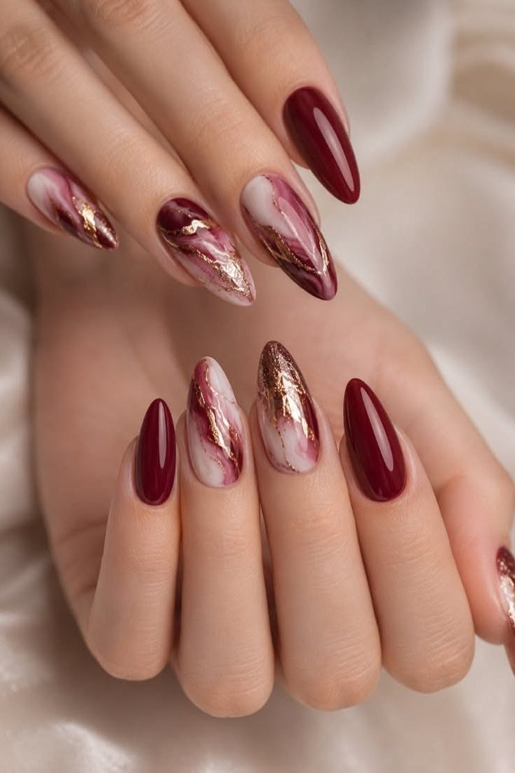 Burgundy marble accent almond nails for women over 50
