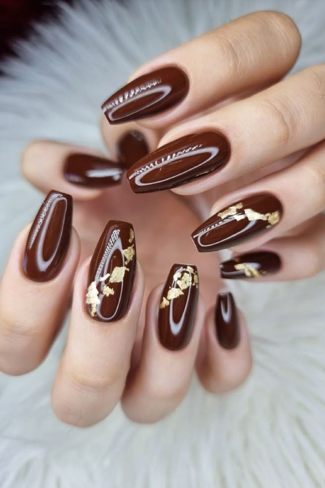 Chocolate with gold leaf art oval, elegant fall nail design for women over 40