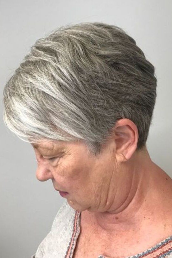 Short gray shaggy pixie bob crop for women over 60, side view