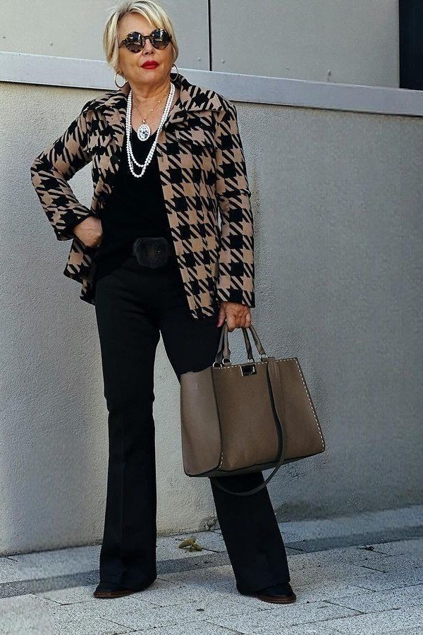 Houndstooth blazer with black top and flared trousers for women over 60
