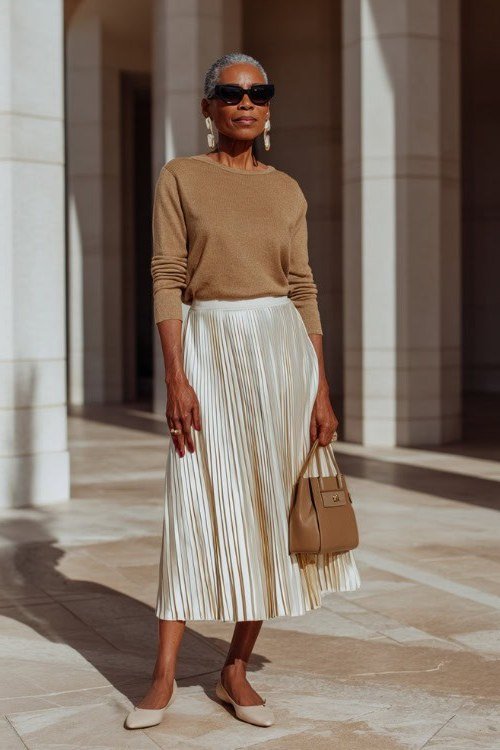 Camel Turtleneck With Cream Pleated Skirt - flattering outfit idea for women over 50, how to dress better over 50