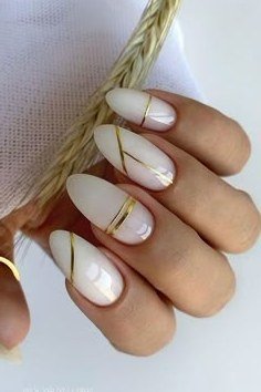 Milky white nails with thin gold line art