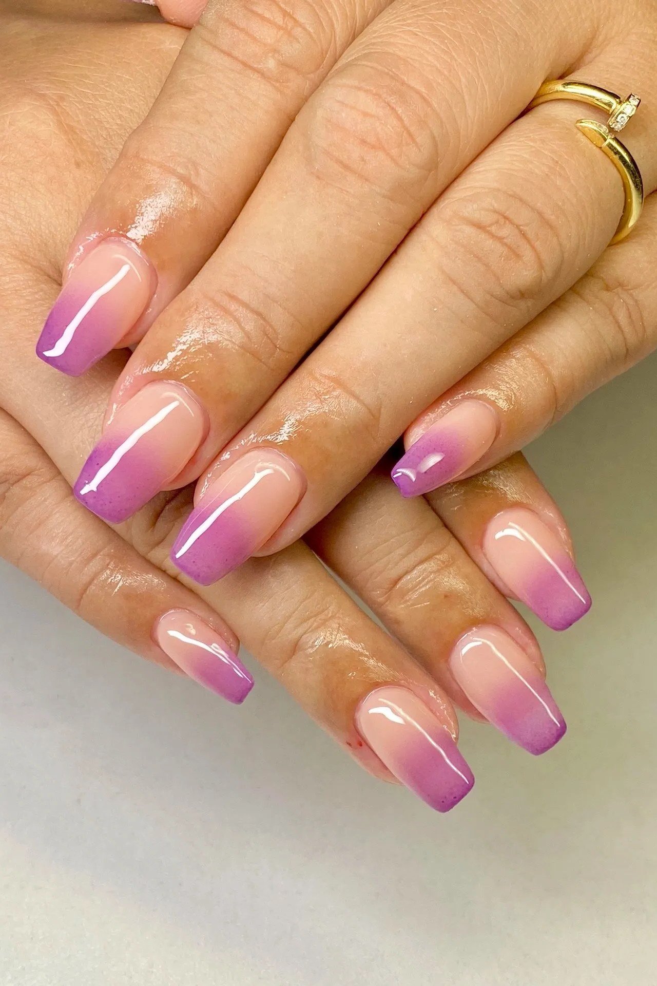 Purple Pink Almond Ombre - Soft lilac melts into rosy pink on these medium almond nails with a smooth glossy finish.