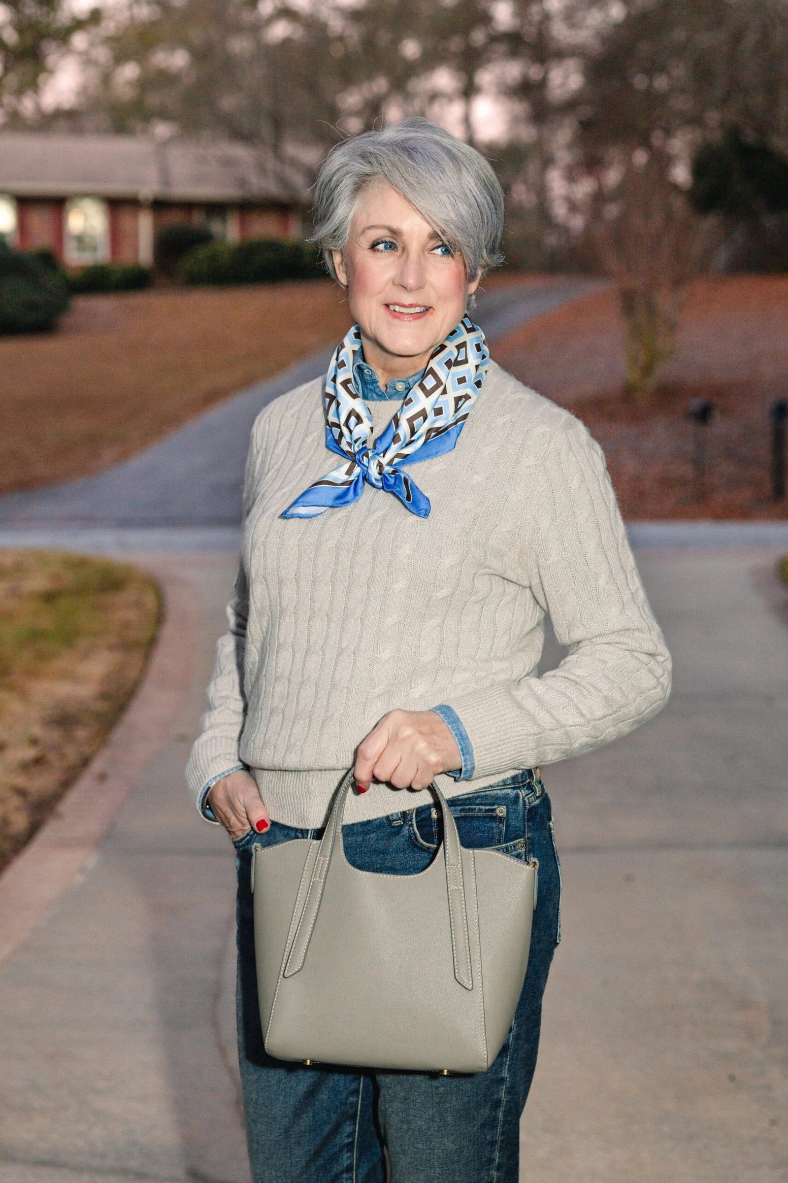 cream cable knit sweater blue scarf jeans fall outfit over 50