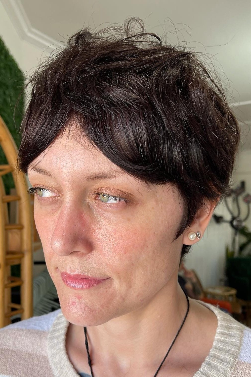 Dark pixie, front view - wispy hairstyle for women over 40