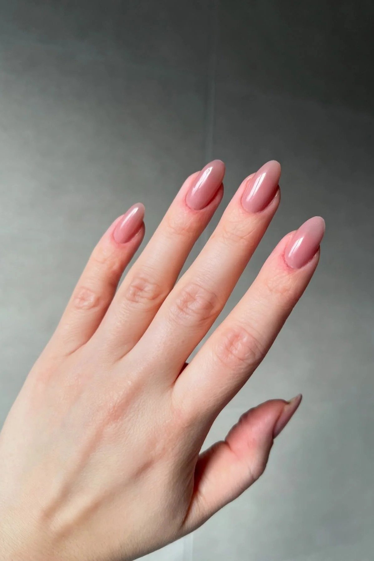 Pink almond nails with hand flat