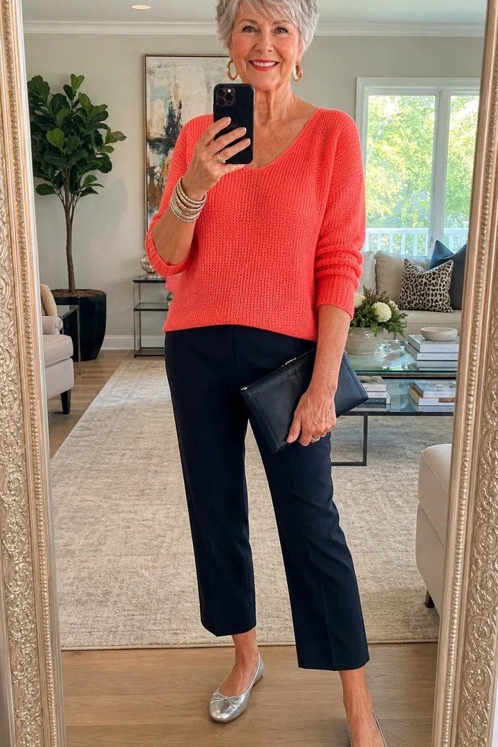 Coral sweater with navy capris for women over 70