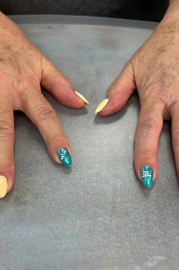 Turquoise and Yellow on Aged Hands - short nail design for women over 40