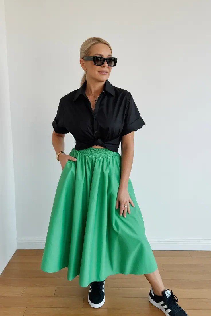 Black Short-Sleeve Shirt With a Green Satin Midi Skirt and Sneakers, smart casual outfit for women over 50