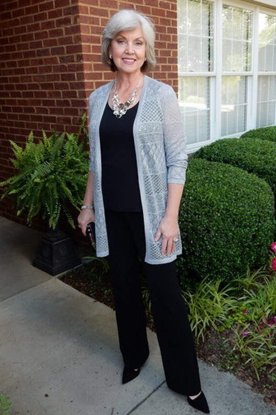 Woman over 50 wearing grey cardigan with black pants, everyday casual outfit idea