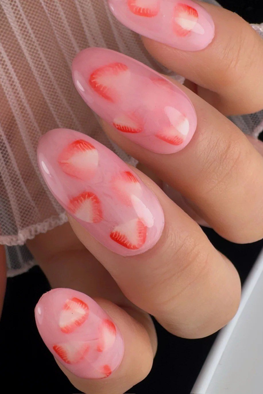 Almond sheer pink nails with strawberry slice art