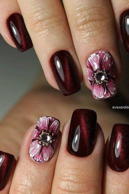Dark burgundy with pink floral accent, burgundy fall nail idea for women over 60