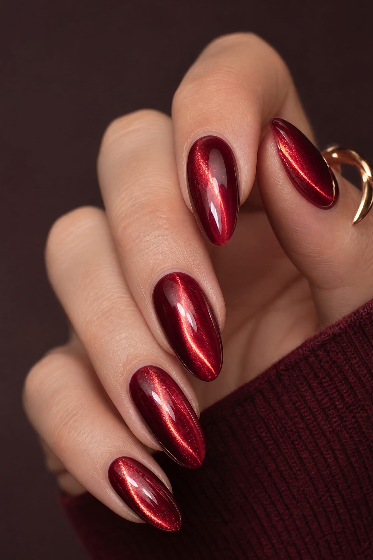 Ruby Streak Cat Eye Nails - Deep ruby red with a bright diagonal magnetic streak covers these medium length almond nails.