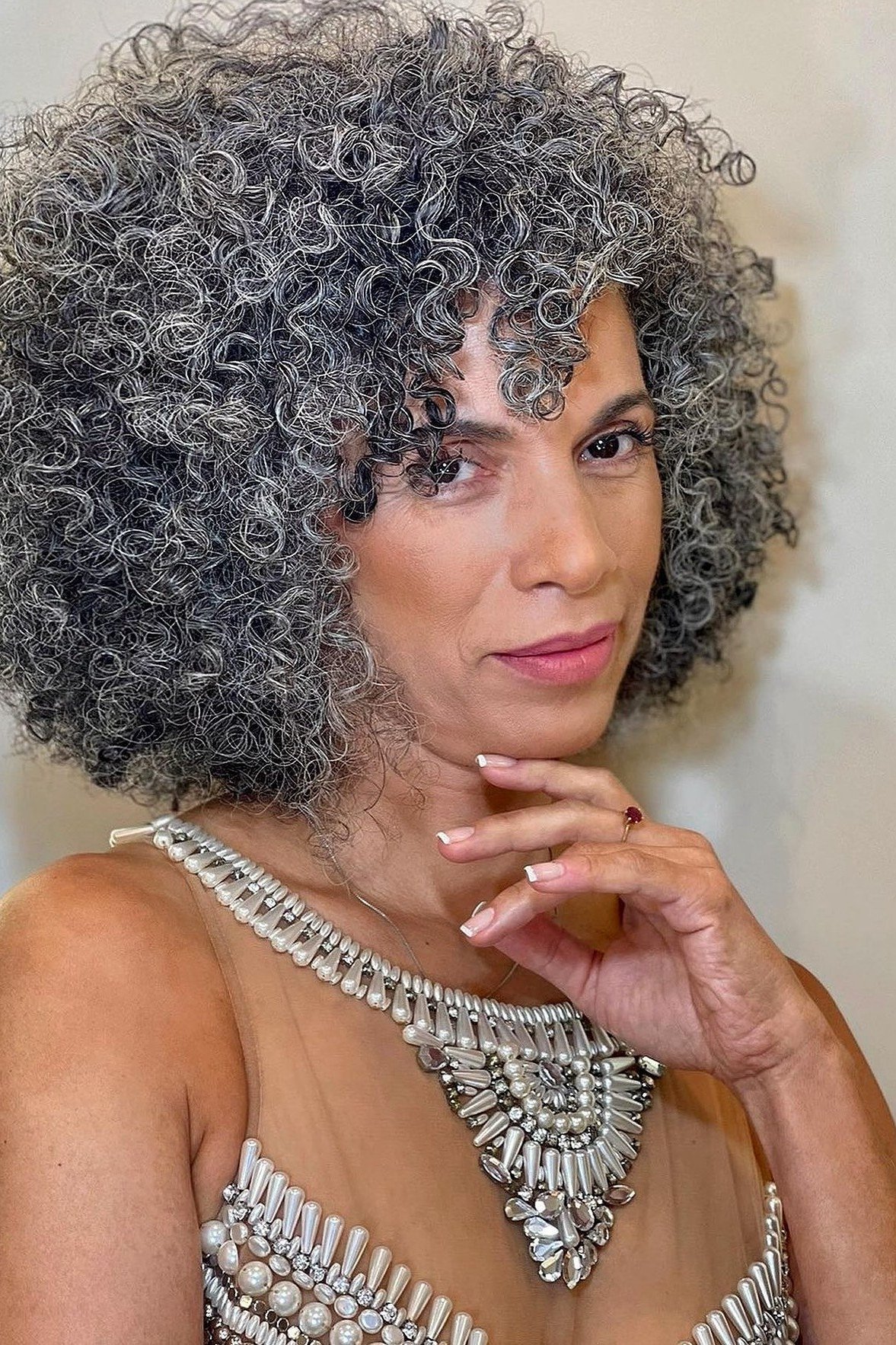 53. Gray Curly Afro - wash and wear hairstyle for older women