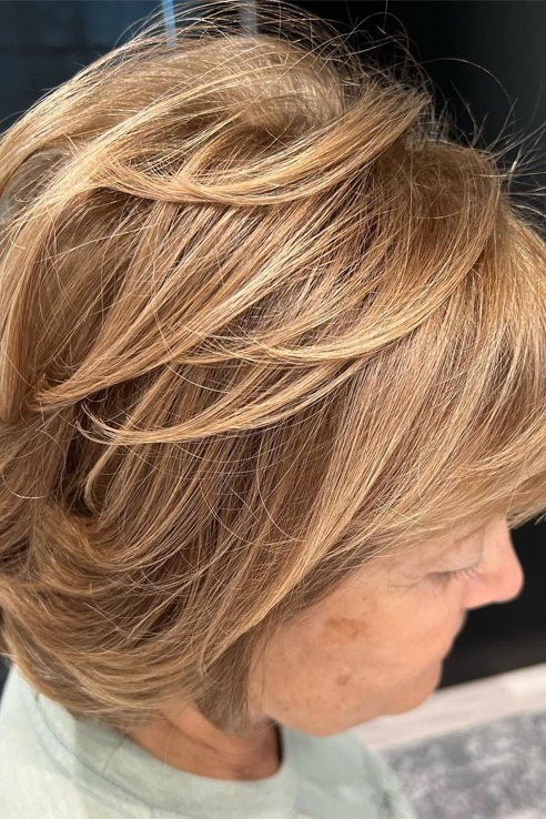 Golden layered bob haircut for women over 50