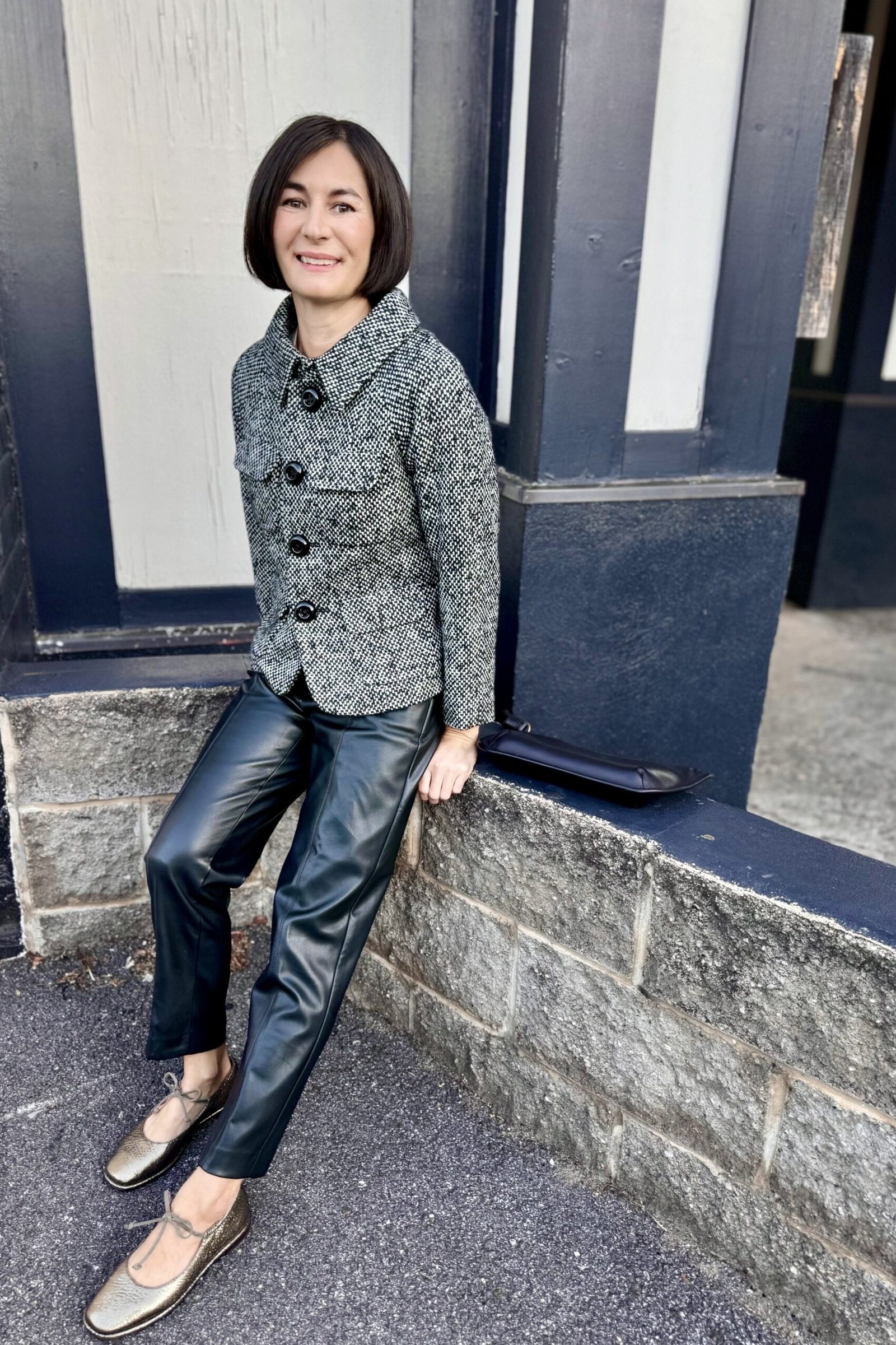 Grey tweed jacket with black leather pants fall outfit idea for women over 60