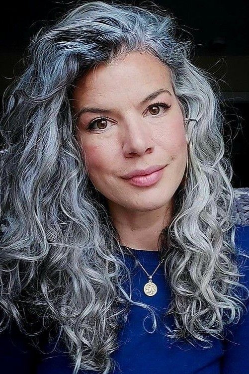 Long curly silver hair with cascading curls