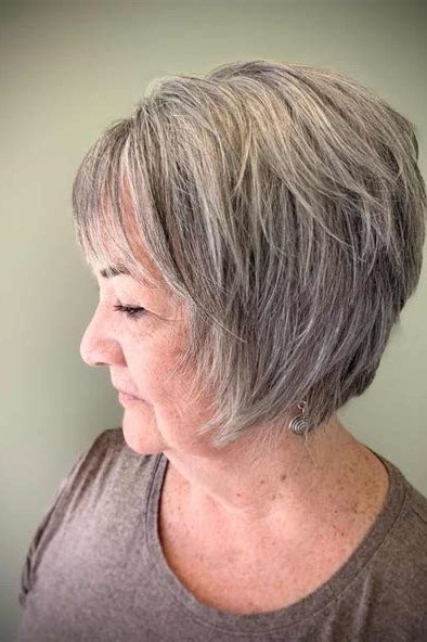 Choppy bob hairstyle for women over 60: grey bob side taupe top