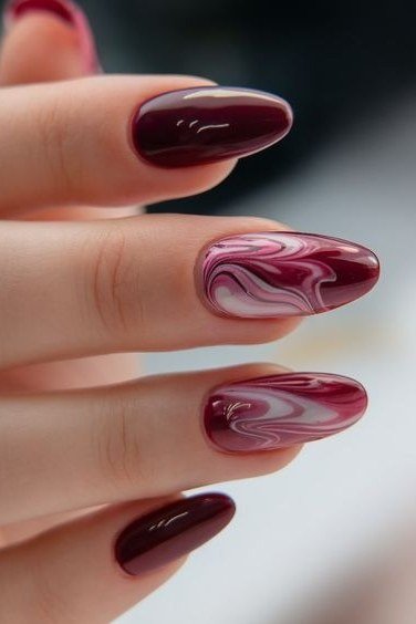 Burgundy marble short oval nails for women over 50