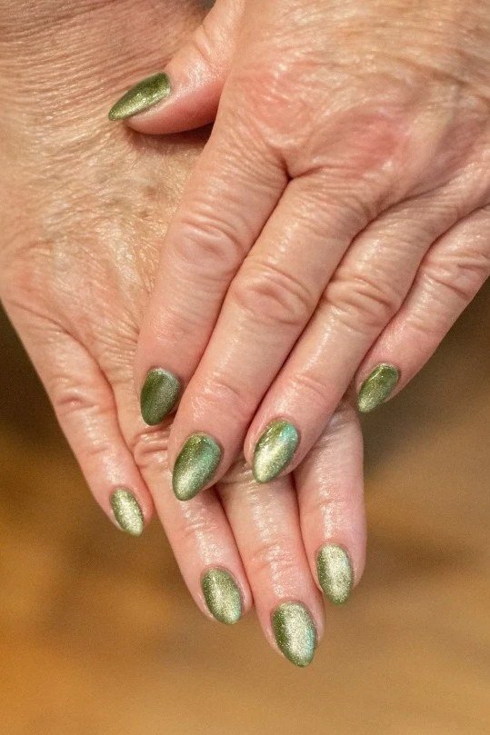 Sage metallic nails on older hands, best manicure idea for women over 60