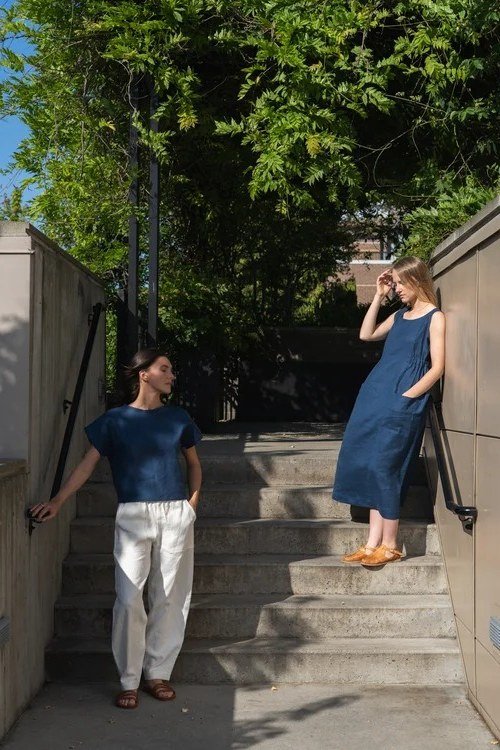 Blue linen dress and white pants, two women on stairs for women over 60
