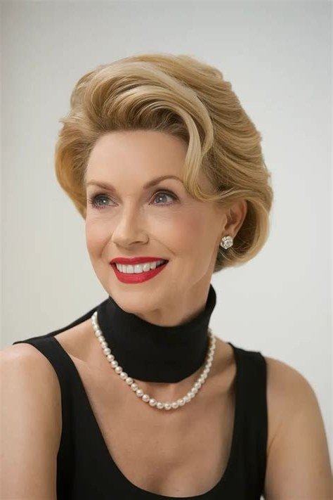 Classic blonde bob with pearl necklace, timeless hairstyle for women over 70