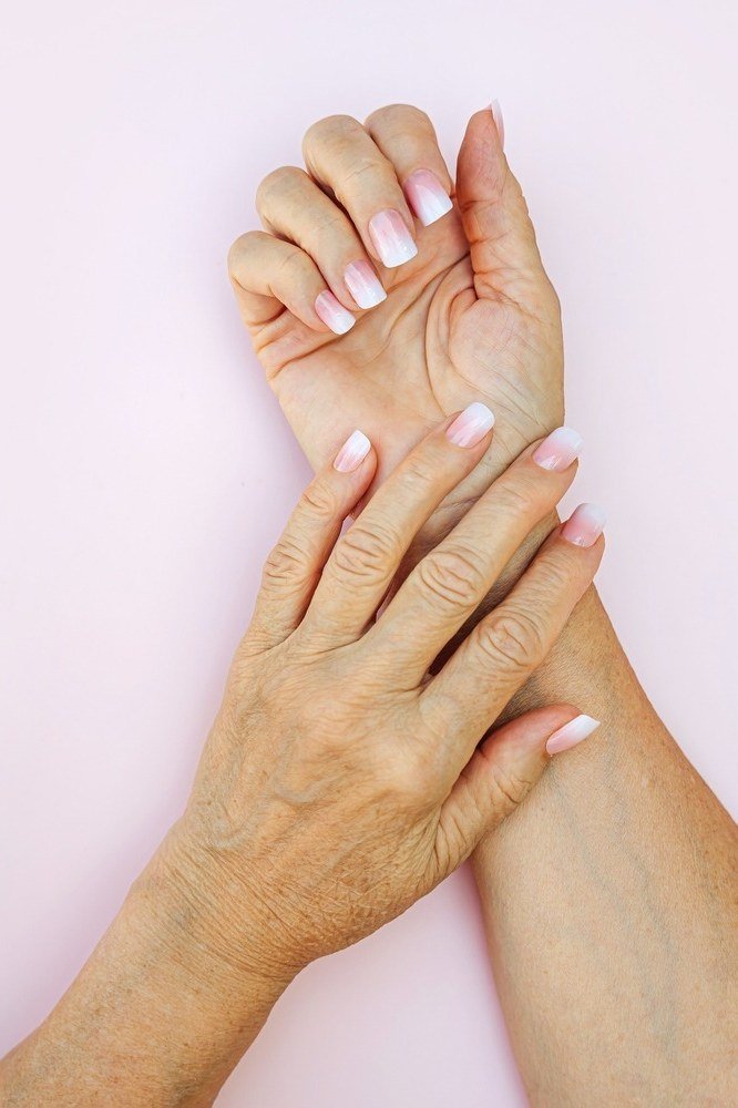 soft pink baby boomer fade on almond nails mature hands