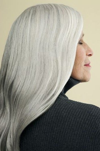 Very long straight silver hair, glass-like silver length for women over 50