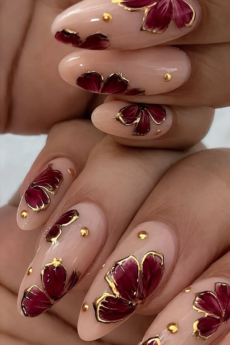 Burgundy floral on nude, burgundy fall nail idea for women over 60
