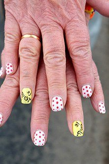 White nails with pastel dot art for older women