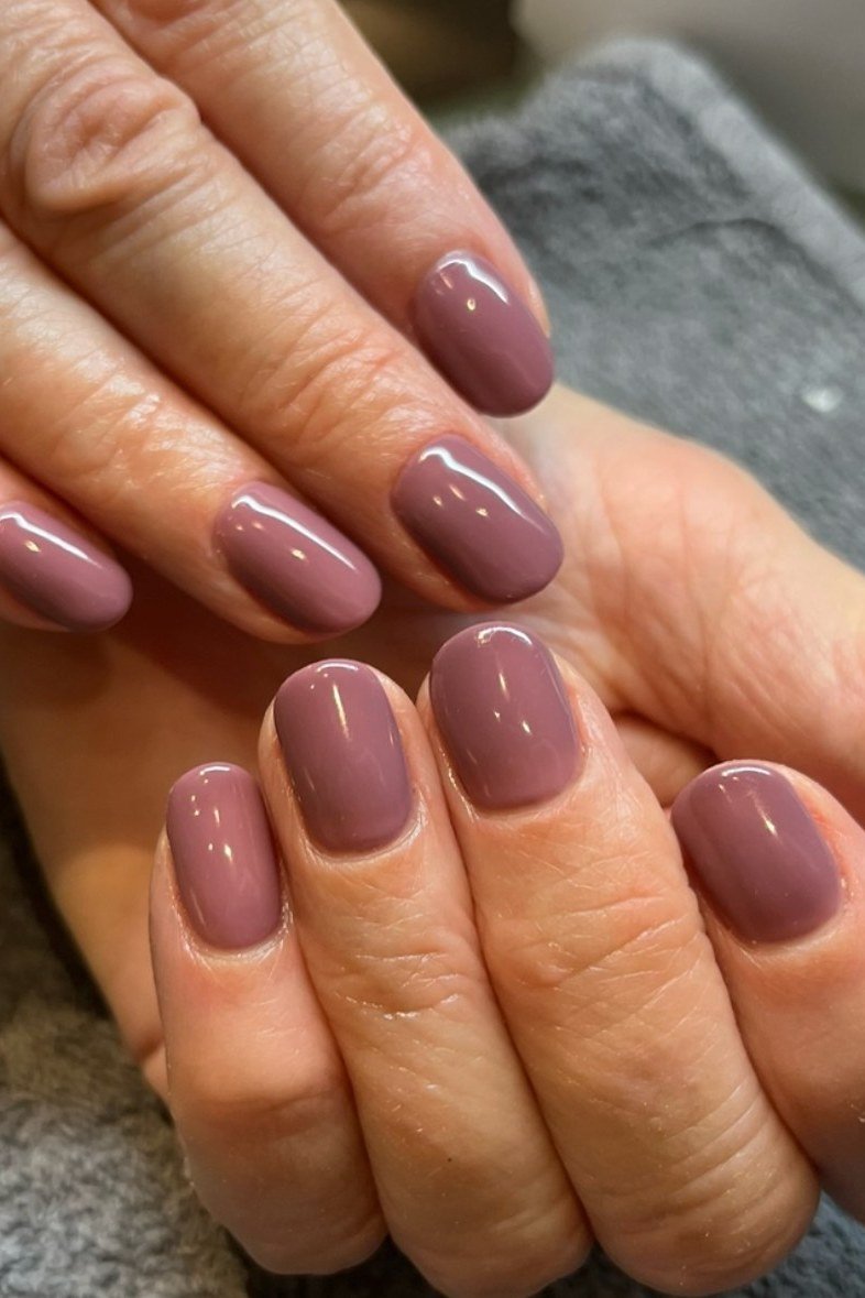 Mauve Glossy Nails with Gold Rings, understated glam nail color for women over 60