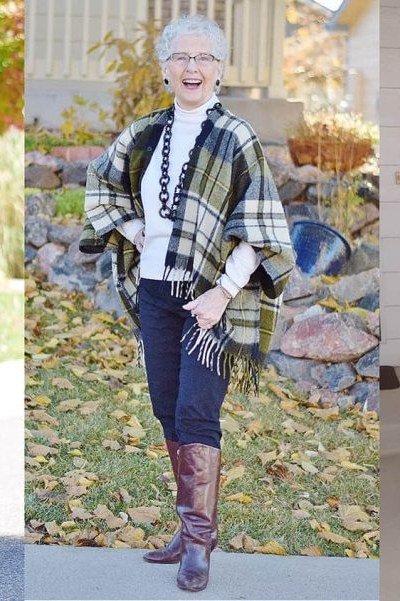 Elegant fall outfit for women over 70: plaid poncho with tall boots