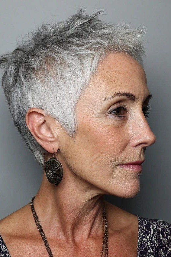 Spiky silver pixie, three-quarter view, micro pixie cut for women over 60 going silver