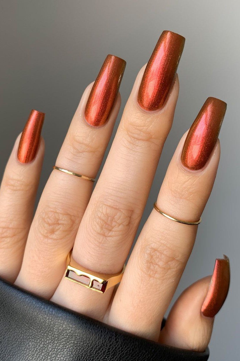 Caramel chrome metallic, almond shape, medium length, glossy, rust sweater cuff, fall nail color for women over 40