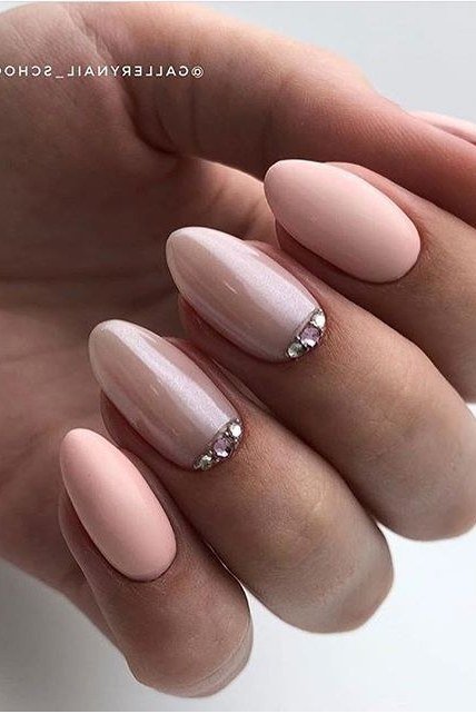 Nude almond nails with crystal accents