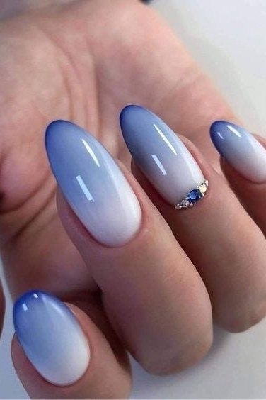 Blue to white ombre with rhinestone accent, medium almond nails, ombre nail design for women over 60