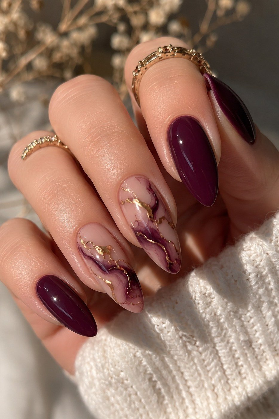 Burgundy marble nails with gold veining for women over 50