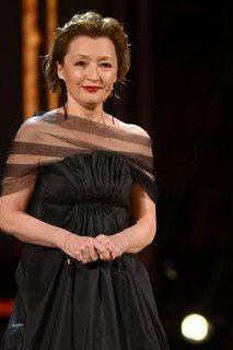 Black off-shoulder evening gown with sheer overlay for women over 50