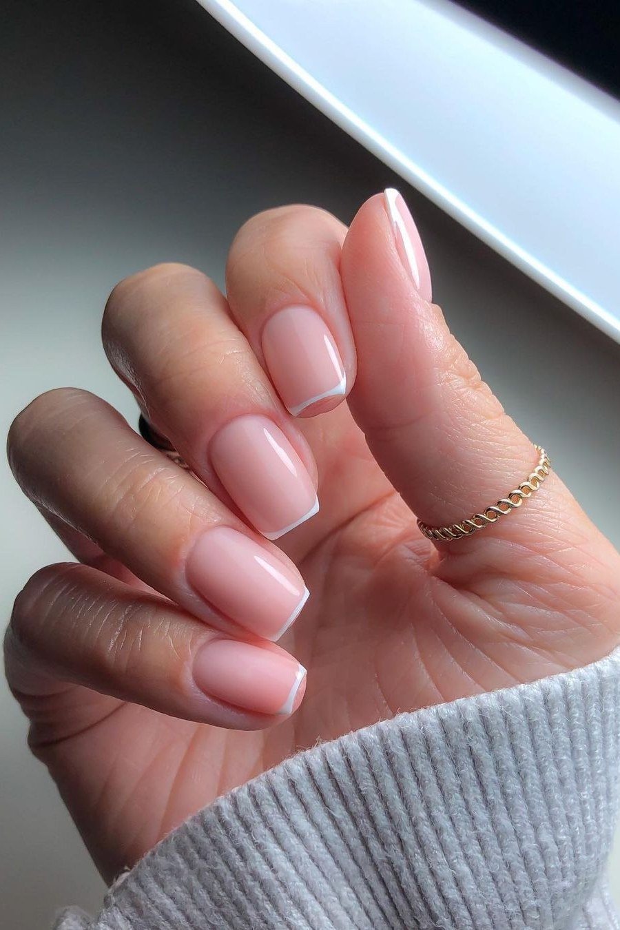 Micro French in a White Sweater - short French nails for women over 60