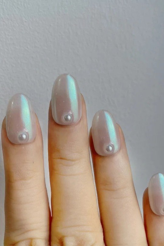 Aurora Chrome Short Oval Nails with Dots - pearl finish nail idea for women over 60