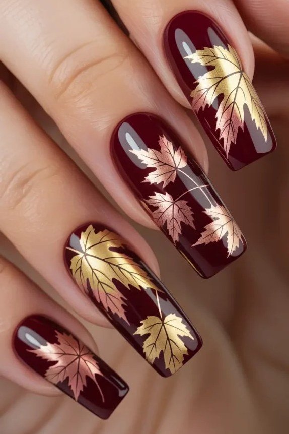 Gold leaf on burgundy coffin, burgundy fall nail idea for women over 60