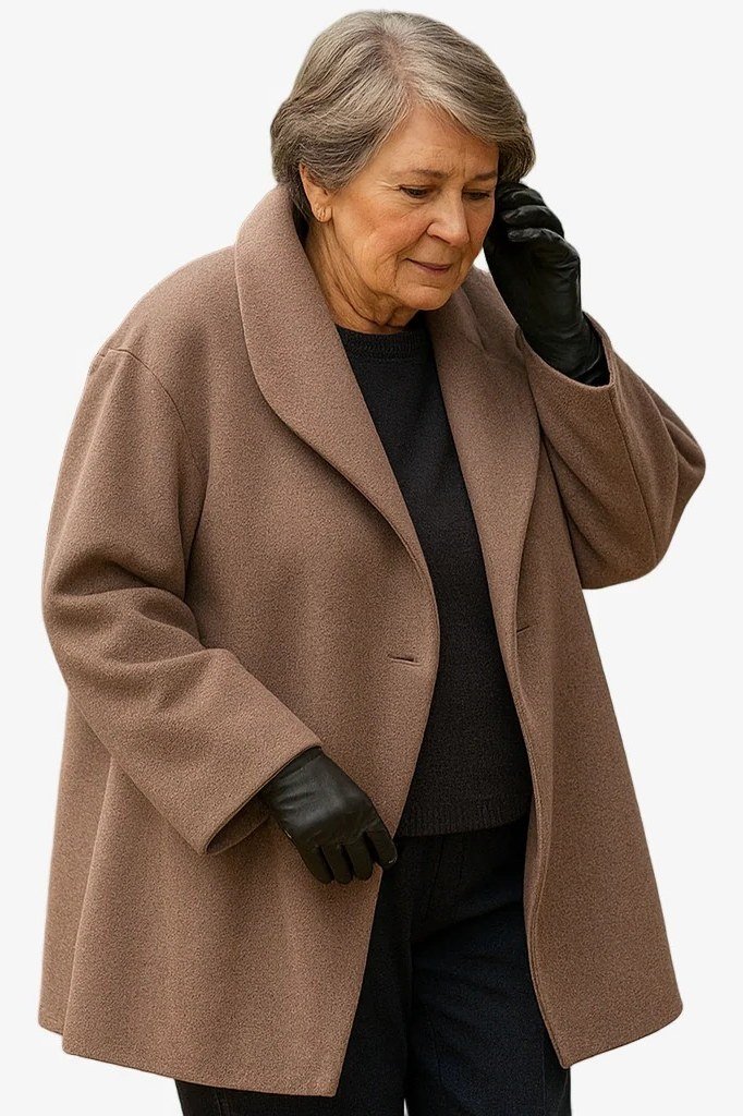 Camel wrap coat with a black top and black gloves for women over 50 at work
