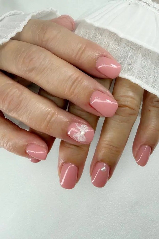 Soft Pink Gel Nails with Floral Accent gel nail idea for women over 60