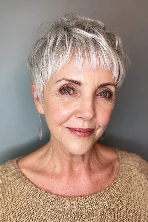 Silver feathered pixie haircut for women over 60, front view